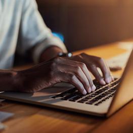 Man working on laptop.
